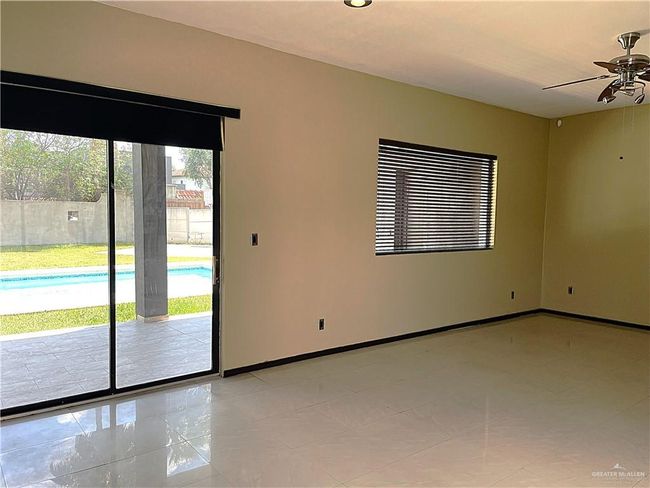 Unfurnished room featuring ceiling fan and baseboards | Image 29