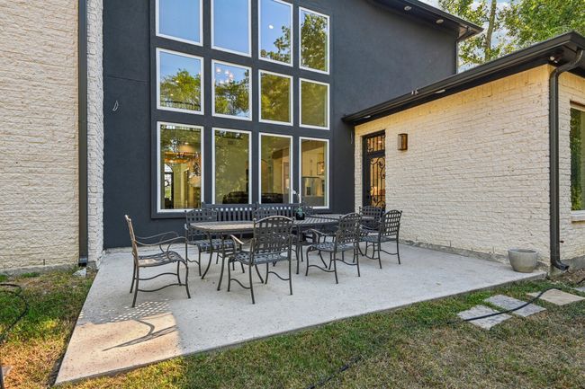 Back of property with stucco siding and a patio | Image 36