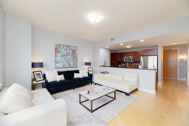 Living room with light wood-style flooring and recessed lighting | Image 6