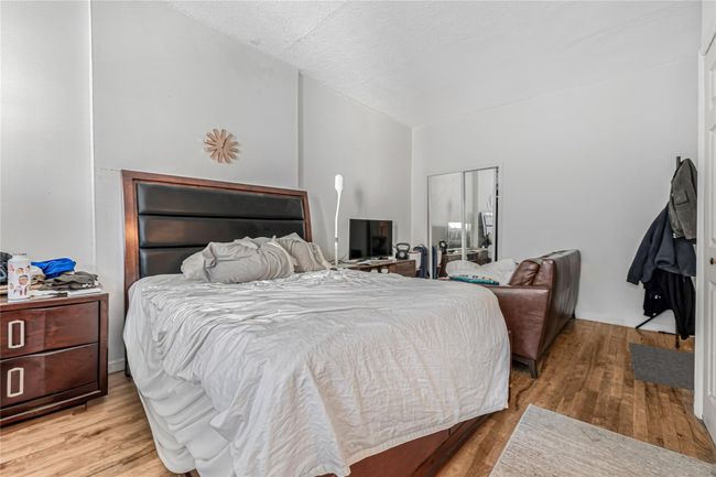 Bedroom featuring wood finished floors | Image 19