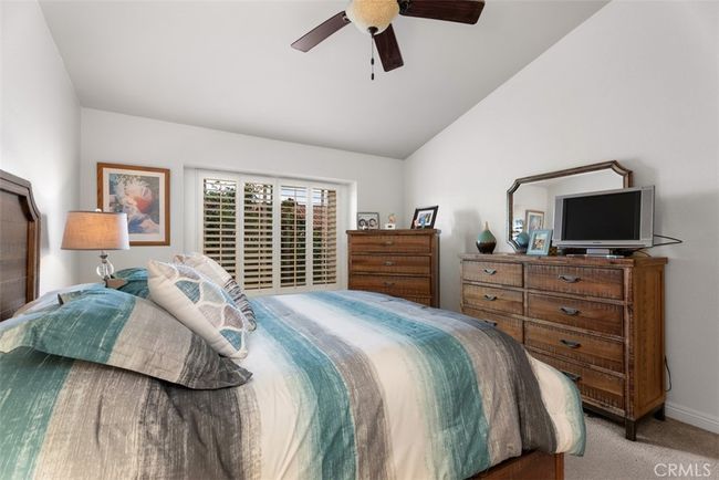 The primary bedroom comes complete with a ceiling fan, great for those warm summer nights | Image 20