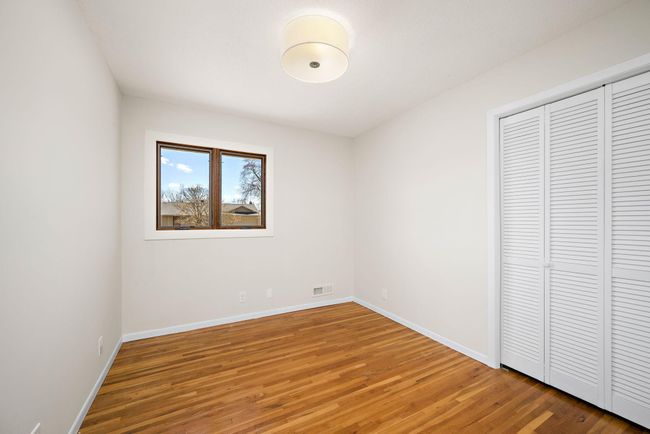 bedroom 2 on main floor with window replaced in 2024 | Image 20