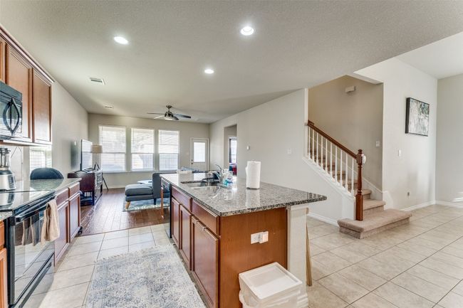 A view from the garage entrance shows the natural flow of the main floor. | Image 13