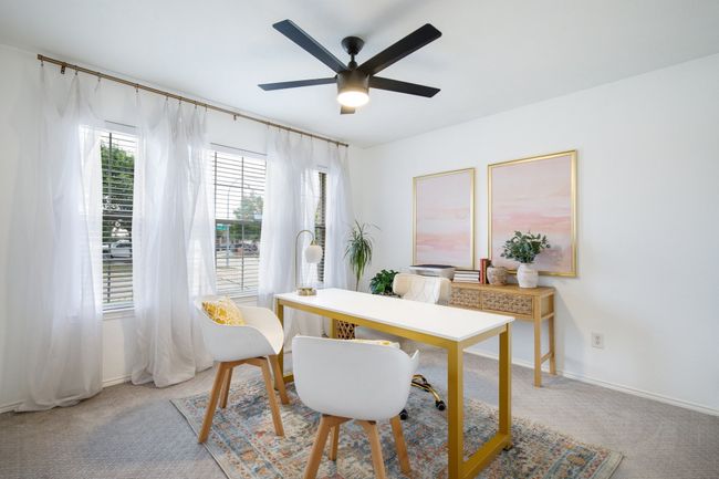 Bedroom or office area with a ceiling fan and light colored carpet | Image 20