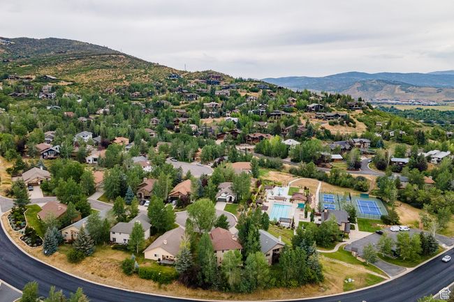 Clubhouse: Community pool featuring fence and a patio | Image 42