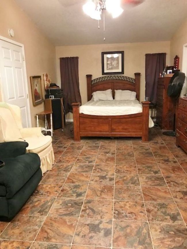 Bedroom featuring ceiling fan | Image 13