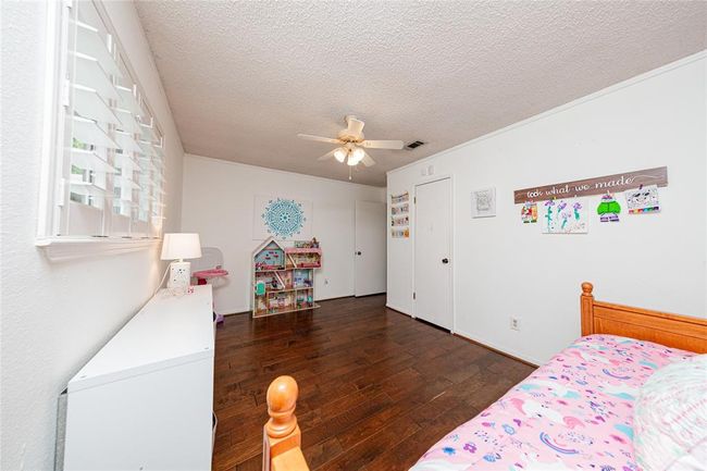 This room has a large closet and plantation shutters as well. | Image 22
