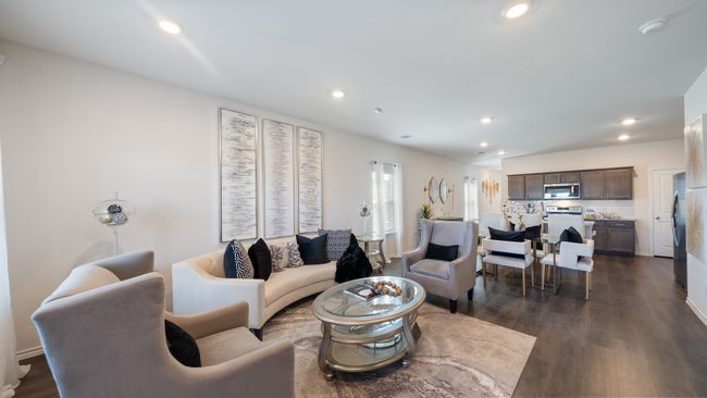 Living room with recessed lighting and dark wood finished floors | Image 13