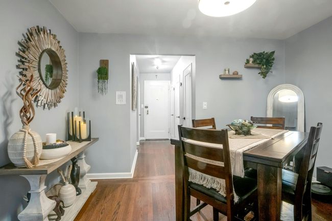 Dining area with wood finished floors and baseboards | Image 8
