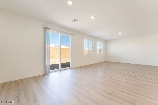 Unfurnished room featuring light wood-style floors and recessed lighting | Image 8