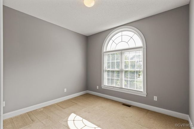 Unfurnished room with light carpet, baseboards, and a textured ceiling | Image 38