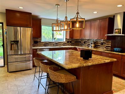 Beautifully appointed kitchen with ample cabinet space. | Image 2