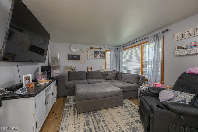 Living area featuring light wood finished floors | Image 8