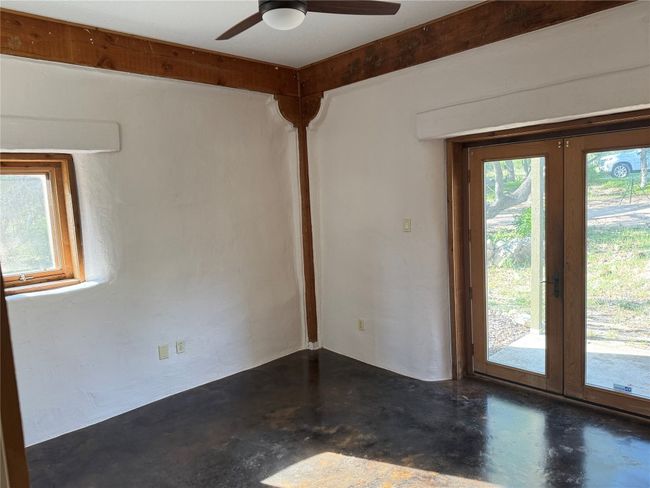 Guest Bedroom main floor french doors, and ceiling fan | Image 17