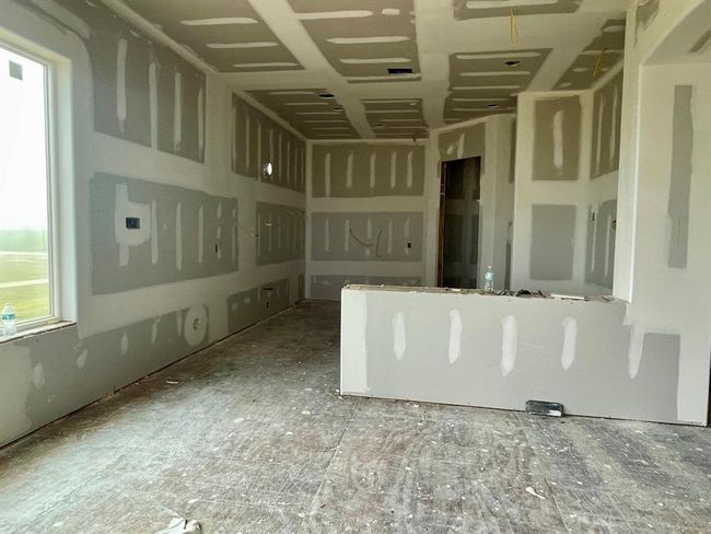 The kitchen is framed and ready for gourmet possibilities — here’s where Café appliances, custom cabinetry, and coastal views will come together to create the kind of kitchen everyone gathers in. | Image 32
