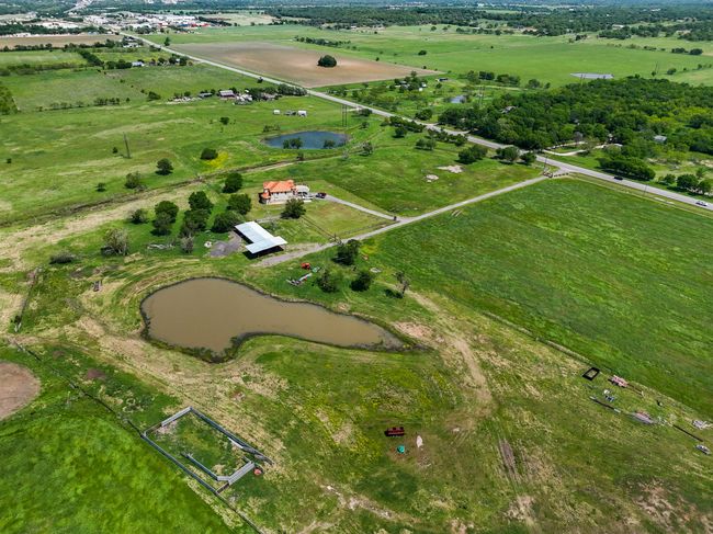 Aerial overview of property's location featuring rural landscape and a large body of water | Image 8