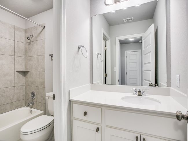 Full bathroom with toilet, vanity, and bathing tub / shower combination | Image 12