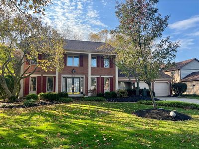 Colonial inspired home with a front lawn and a garage | Image 2