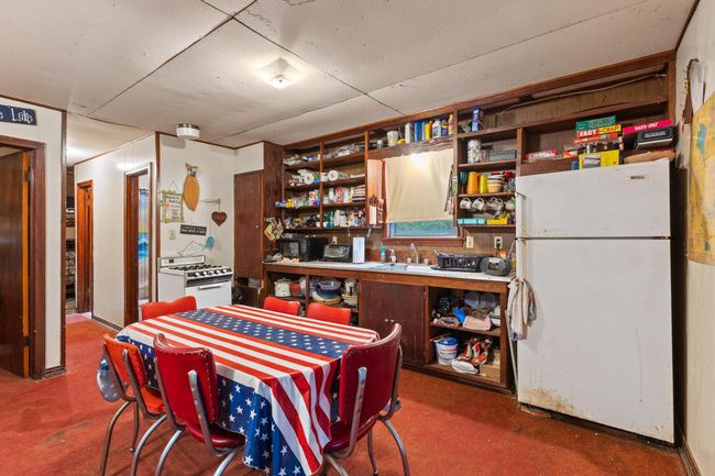 Dining space featuring concrete floors | Image 24
