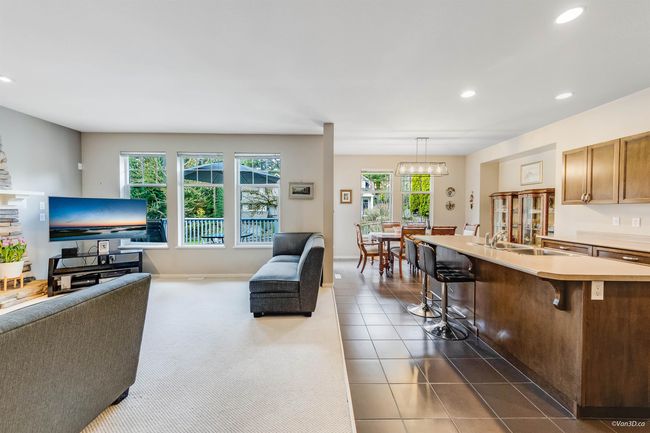 Living area featuring dark tile patterned floors and recessed lighting | Image 4