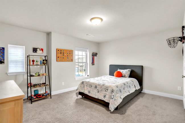 Bedroom featuring baseboards, visible vents, and carpet floors | Image 23
