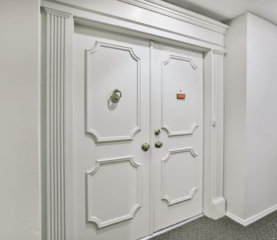 CUSTOM DETAILS BEGIN AT THE ENTRANCE WITH FLUTED MOLDING AND DOUBLE DOORS | Image 2