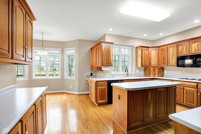 Kitchen looking from Dining Rm towards bay window casual dining area | Image 9