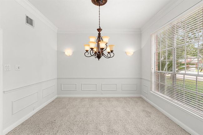 Formal dining room has wall mounted sconces which can be dimmed for mood. Chandelier has a dimmer as well. | Image 7