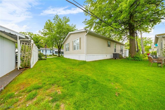 View of green lawn featuring central AC unit | Image 15