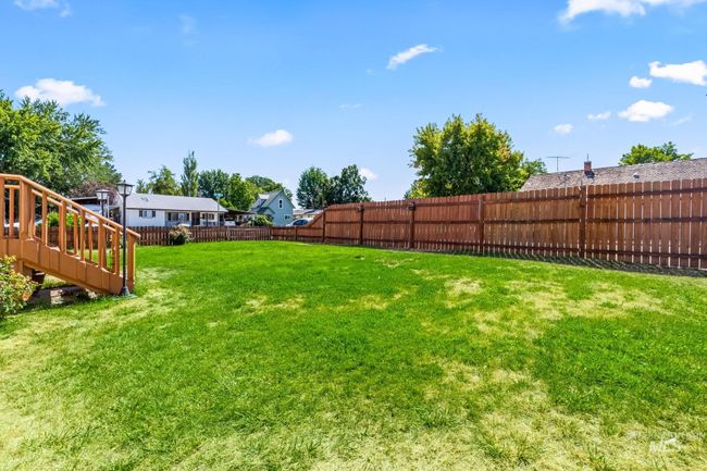View of fenced backyard | Image 24