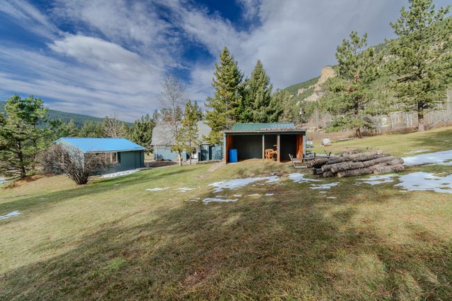 View of yard with an outbuilding and a mountain view | Image 76