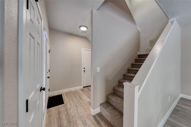 Foyer with wood finished floors and stairway | Image 4
