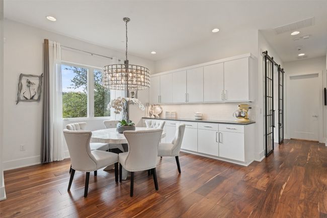 A cozy breakfast nook nestled just off the chef’s kitchen, perfect for everyday meals and morning coffee. | Image 18