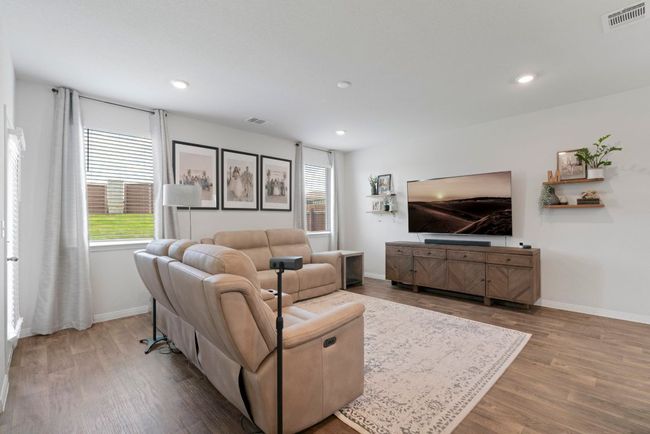Living room with wood finished floors and recessed lighting | Image 7