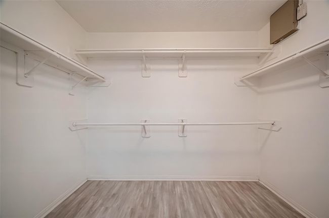 Primary closet with lots of storage space. | Image 24