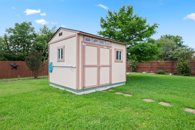 View of shed featuring a fenced backyard | Image 34
