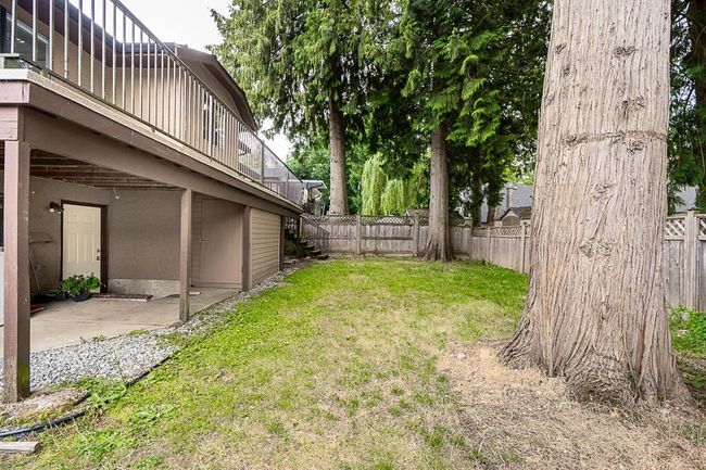 Fenced yard featuring stairway, a patio, and a wooden deck | Image 35