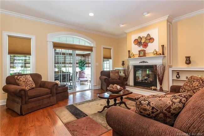 An arched transom window above the door leads you to your cheerful sun room. | Image 13