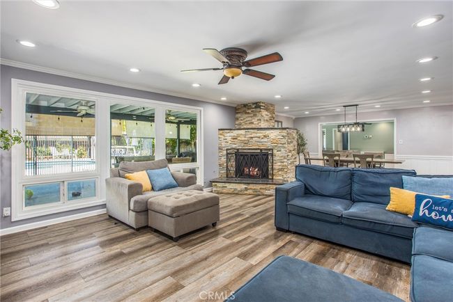 Plenty of natural light and view of the backyard, patio and pool | Image 9