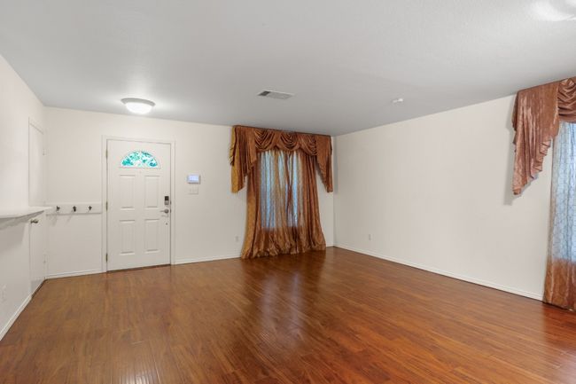 Entrance foyer with wood finished floors and baseboards | Image 5