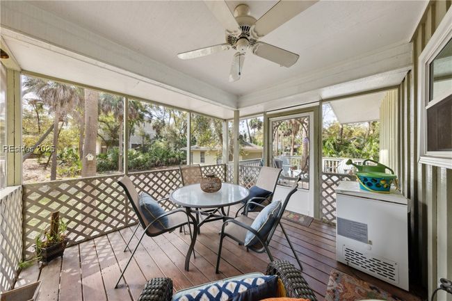 Screened in covered lanai is a wonderful spot for morning coffee or relaxing afternoon cocktails, while an adjacent seperate porch serves as a bbq space. | Image 55