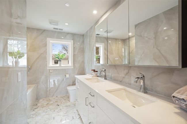 Bathroom featuring toilet, a sink | Image 23