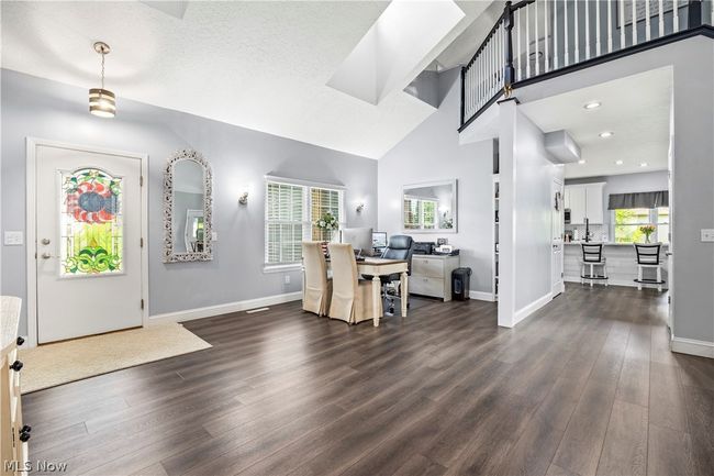 Foyer entrance with high vaulted ceiling and dark hardwood / wood-style floors | Image 6