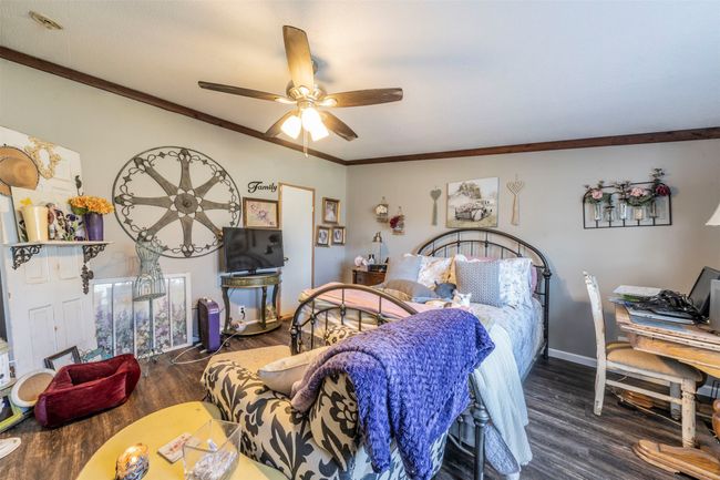 Nice size room, ceiling fan, no carpet throughout, lots of natural light. | Image 9