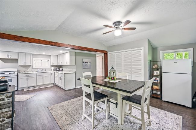 laundry located right off the kitchen in closet area | Image 13