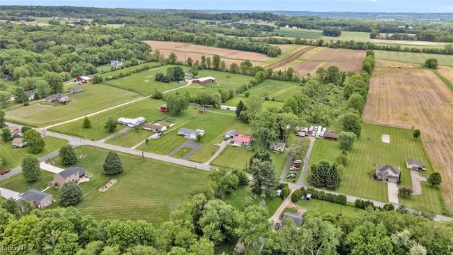 Aerial view of property and surrounding area with rural landscape and large plots for crops | Image 39