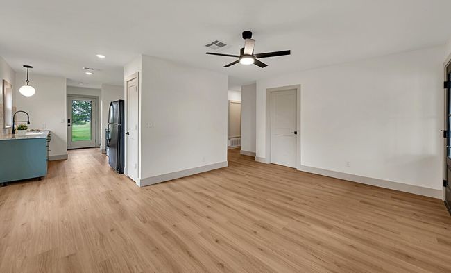 Guest house Living room with ceiling fan, light wood-type flooring, and recessed lighting | Image 35