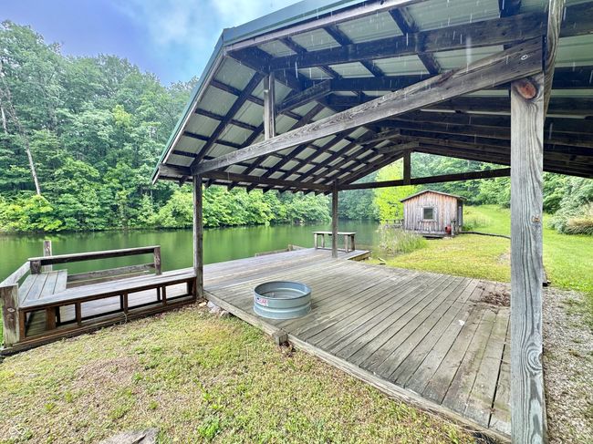 dock area with a water view and a lawn | Image 29