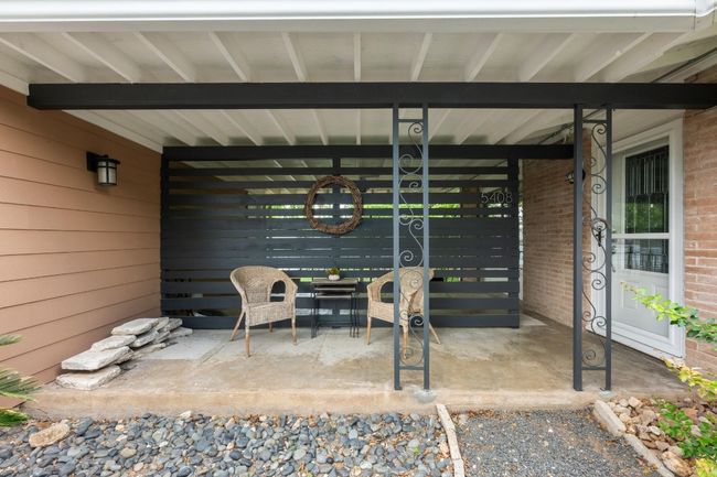 The front porch is spacious for welcoming furniture and planters! | Image 21