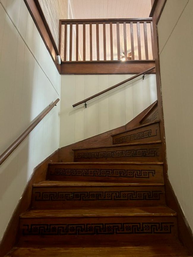 Stairway featuring wood finished floors | Image 24